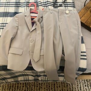 6T grey suit with clip on tie.